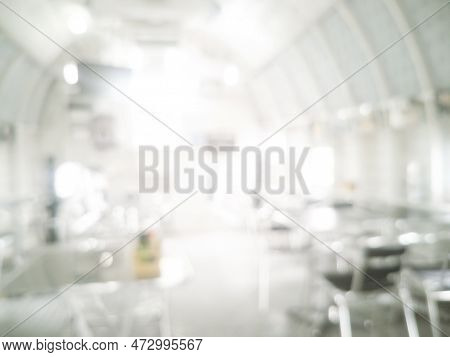 White Blurred Background Bright Restaurant Shopping Mall Silver Gray Lighting. Defocused Store Light
