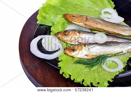 Smoked Fish, Salad And Onion On A Black Plate
