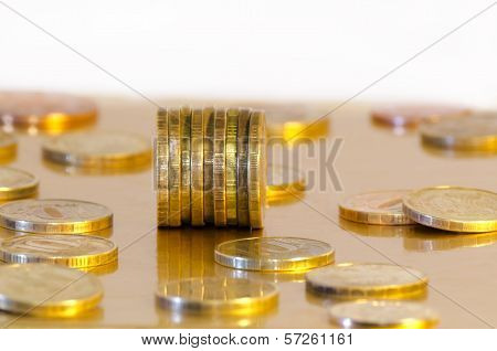 Coins are reflecting in the Golden surface