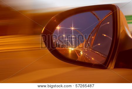Reflection Of High-speed Road On Car Mirror