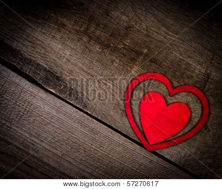 Red hearts on old wood with copy space.