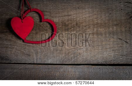 Red hearts on old wood with copy space.