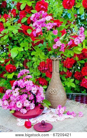still life bouquet with roses and tea pot