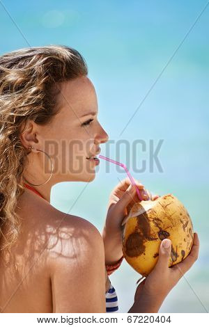 Portrait Of Woman Relaxing With Cocktail At Cuban Beach