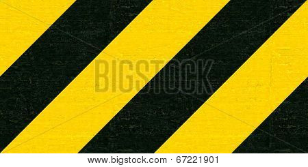 Warning black and yellow hazard stripes texture. Construction sign
