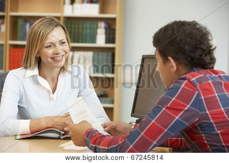 College tutor with student