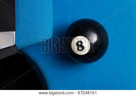 8 Ball Resting Near The Pocket