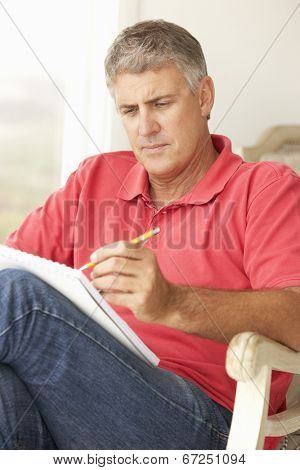 Mid age man sketching