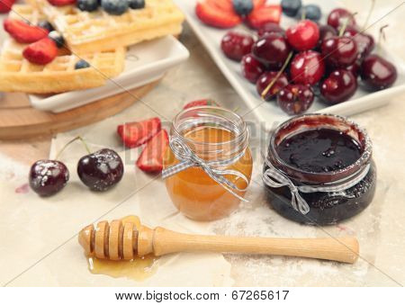 Sweet waffles with honey and berries