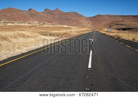 Straight Road Heading Towards Mountains In Orange Free State