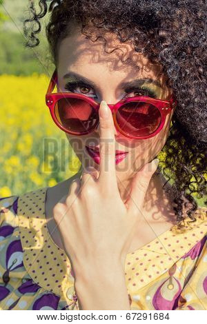 young beautifu girl in red sun glasses