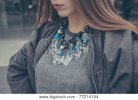 glass necklace with horses on woman