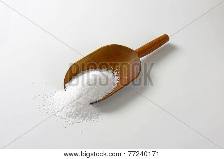 wooden measuring spoon with portion of salt