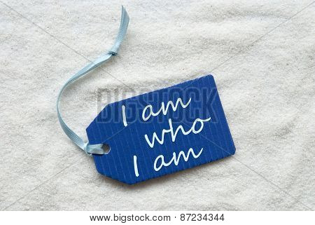I Am Who I Am On Blue Label Sand Background
