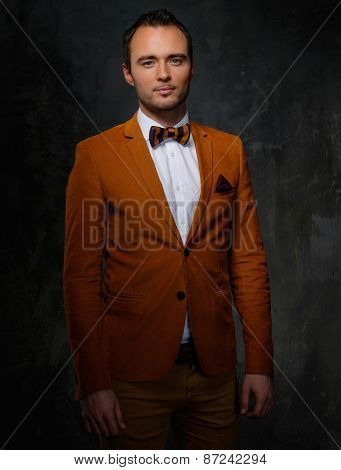 Sharp dressed fashionist wearing jacket and bow tie