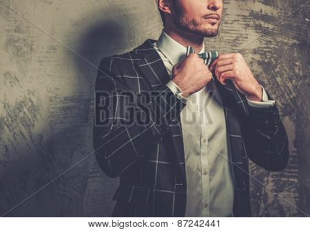 Sharp dressed fashionist wearing jacket and bow tie