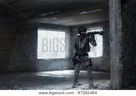 Airsoft strikeball player in military soilder uniform