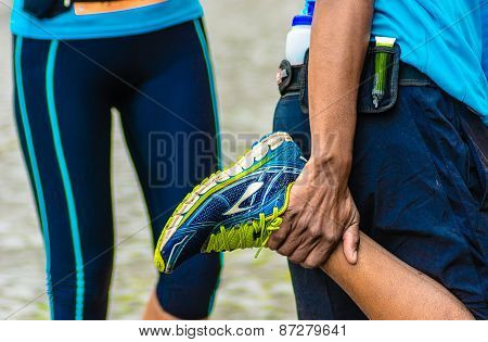 Runner Stretching His Right Leg