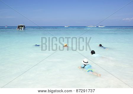 Traveler Swimming On The Clear Water Beautiful Sea
