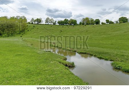 Background of sky, clouds, field  and river