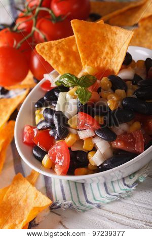 Mexican Food: Salsa In A Bowl And Corn Chips Nachos Macro. Vertical