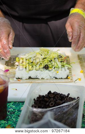 Chef Otdoors Is Prepairing Sushi Rolls, Fresh Ingredients.