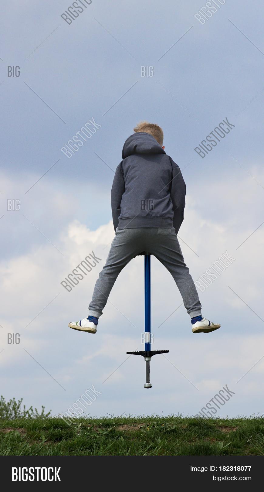 Boy On Pogo Stick Image & Photo (Free Trial) Bigstock