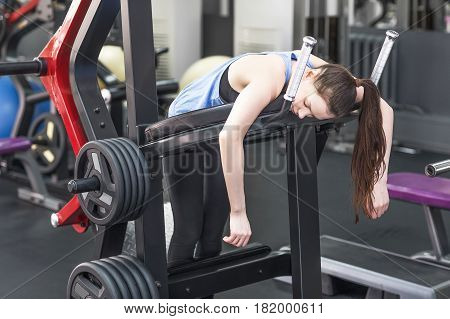Portrait of tired woman having rest after workout.