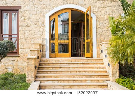 Wooden front door of a home. Front view of a wooden front door.