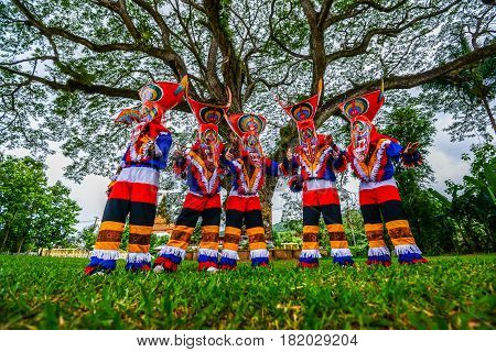 Kid dancers with ghost mask made from bamboo to show in Thai northeastern traditional Phi Ta Khon ghost Festival
