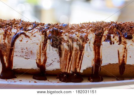 Slices Of Sweet Cream Roll On A Cutting Board