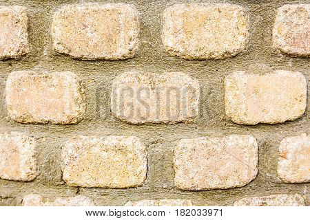 Background wall made of stone. Fragment of a wall from a chipped stone