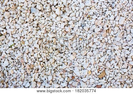 Background wall made of stone. Fragment of a wall from a chipped stone