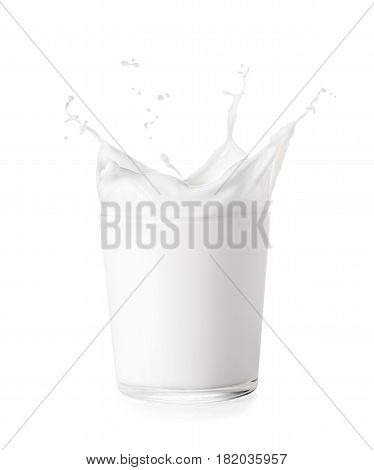 splash of milk from the glass isolated on white background. Glass of milk with splash crown
