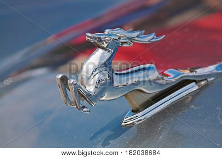 Volgograd Russia - May 09 2010: Running deer emblem on the hood of Soviet car Volga GAZ-21