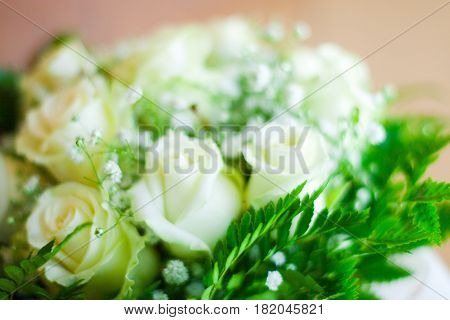Bucket of white flowers for a bride