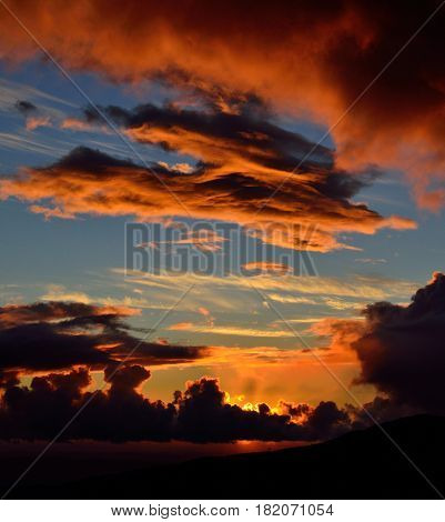 Vibrant sunrise with cloudy sky of vivid colors