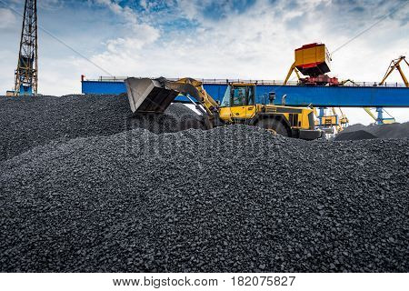 Maritime transportation industry. Work in port coal transshipment terminal.