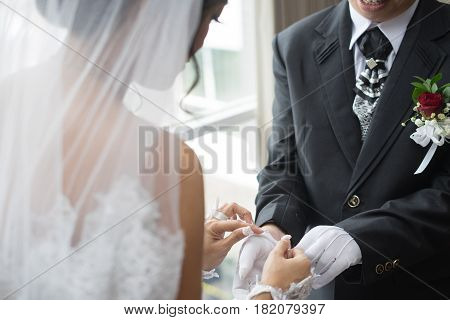 bride undressing white gloves groom morning preparation on her wedding