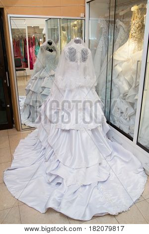 white wedding dress gown on mannequin in bridal gown. Bride's morning wedding preparation concept