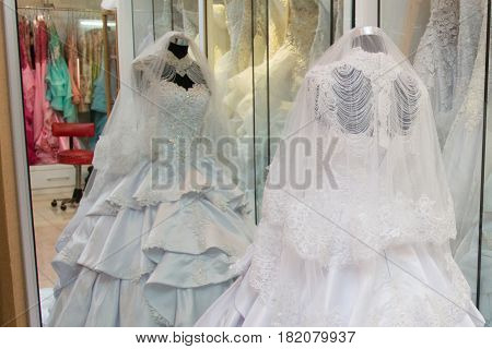 white wedding dress gown on mannequin in bridal gown. Bride's morning wedding preparation concept