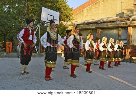 Ivanovo Serbia August 15 2016. The group of young people dancing traditional folk dances from the region of Serbia.