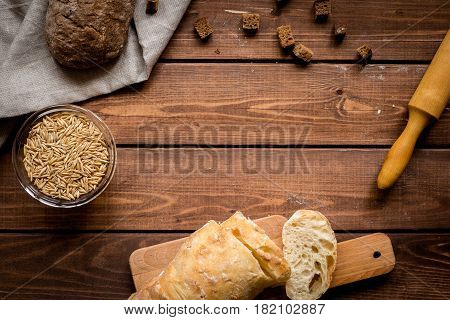 Baking fresh homemade bread on wooden kitchen table background top view moke up