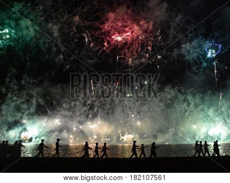 Skyfire 2017 in Canberra Australia. Fireworks during Canberra's annual SkyFire appear above Lake Burley Griffin. Australian Federation Guard moving away at Gallipoli Reach.