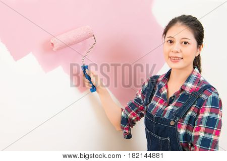 Woman Painting New Apartment Standing