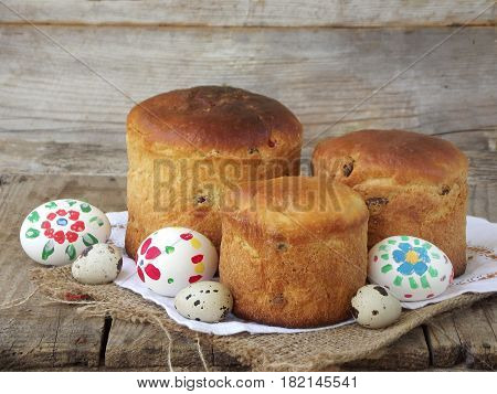 Easter Composition Of Sweet Bread, Paska And Eggs On Wooden Background. Orthodox Kulich. Holidays Br