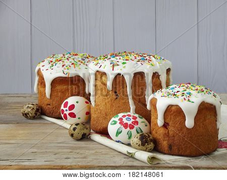 Easter Composition Of Sweet Bread, Paska And Eggs On Wooden Background. Orthodox Kulich. Holidays Br
