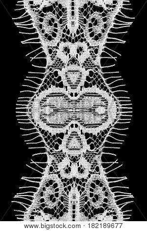 White vintage decorative lacy ribbon isolated over black