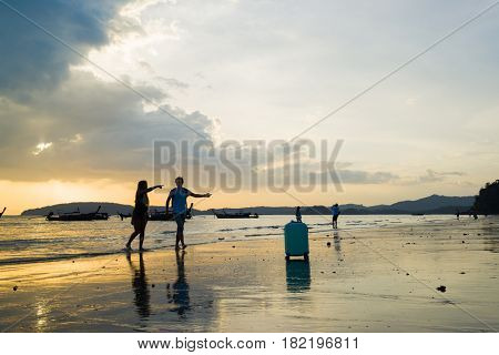 Ao Nang Krabi Thailand - March 02 2017: People on the Ao Nang beach at sunset in Krabi province Thailand
