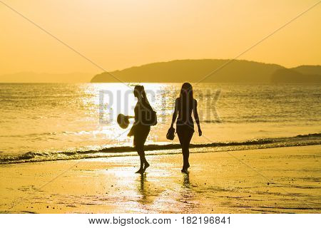 Ao Nang Krabi Thailand - March 02 2017: People on the Ao Nang beach at sunset in Krabi province Thailand